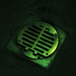 Why Your Basement Drain Is Clogged (and How to Fix It Fast) Clogged basement floor drain on a concrete floor