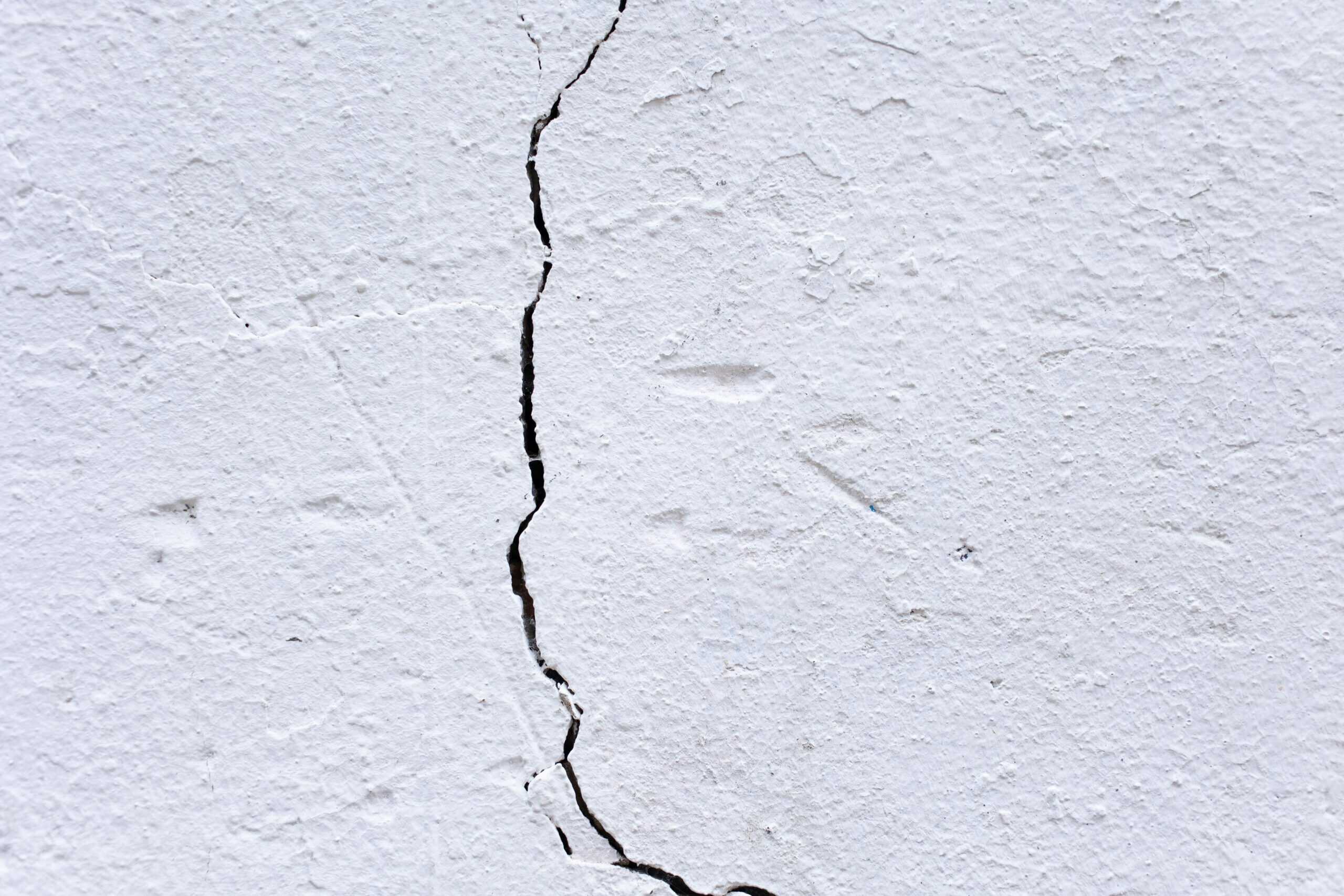 Cracked basement wall repair for foundation stability and waterproofing.