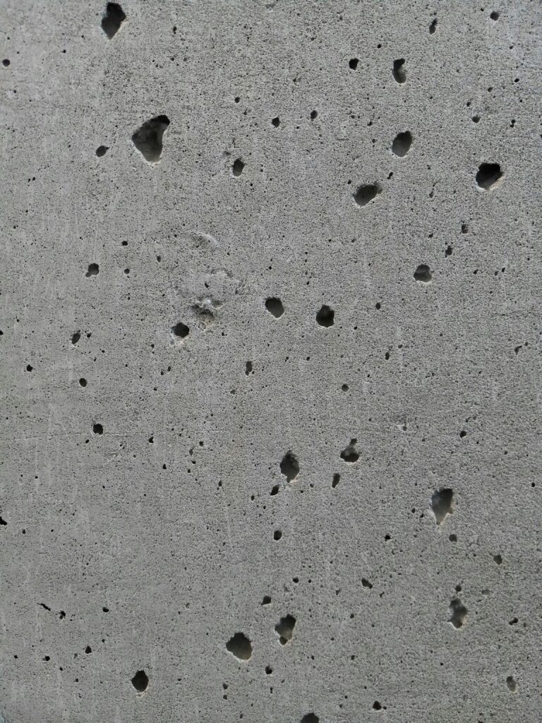 Concrete basement wall drying before painting to prevent moisture-related paint failure